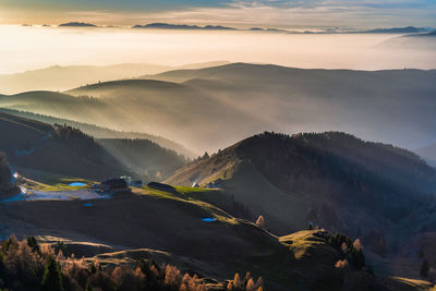 Scenic view of mountains against sky during sunset