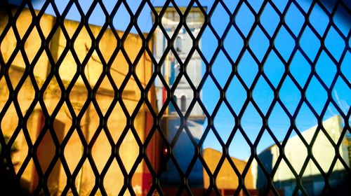 Full frame shot of chainlink fence against clear sky