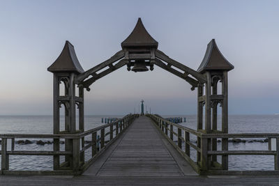 View of pier on sea against sky