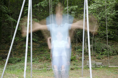 Low section of man at waterfall