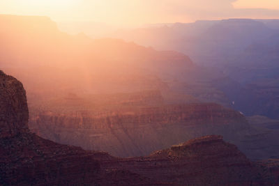 Sunset light spills through the grand canyon at navajo point in grand canyon national park, arizona. 