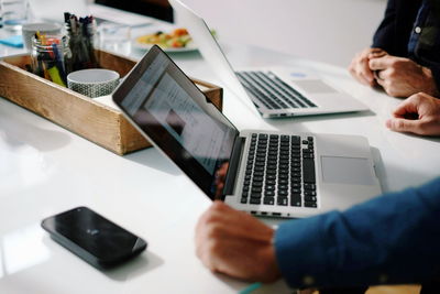 Surface level view of two men at office desk