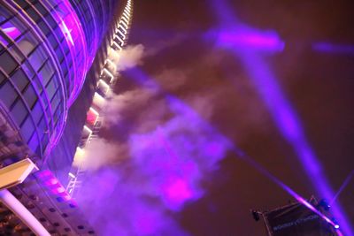 Low angle view of illuminated ferris wheel