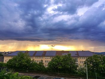 Buildings against sky during sunset