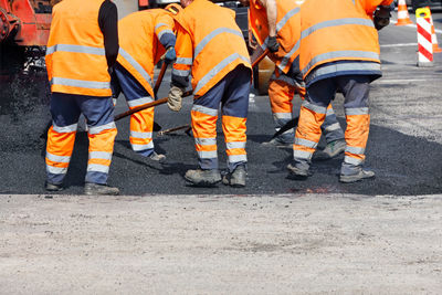 Group of people walking on road