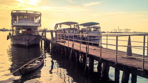 View of bridge over river at sunset