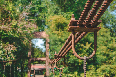 Close-up of rusty metallic structure in forest