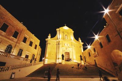 Low angle view of steps at night