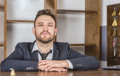 Portrait of man sitting at table