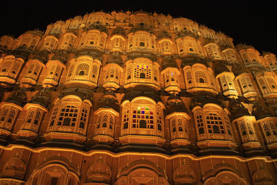 Low angle view of illuminated building at night