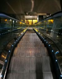 Illuminated escalator at night