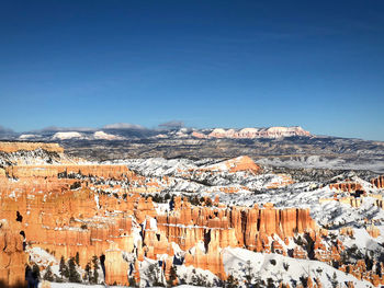 High angle view of landscape against blue sky