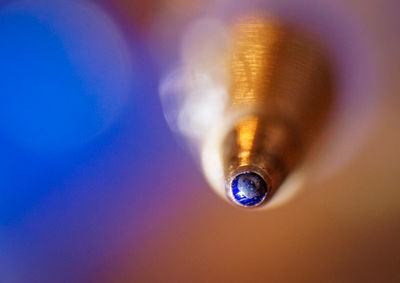 Close-up of water drop on metal