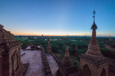 Panoramic view of temple against sky at night