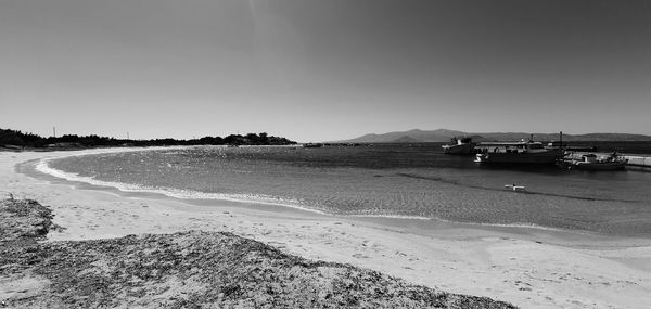 Scenic view of beach against clear sky