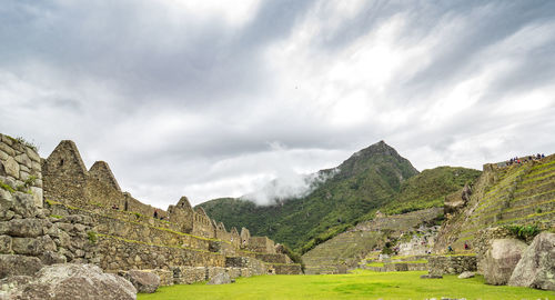 Scenic view of green mountains against sky