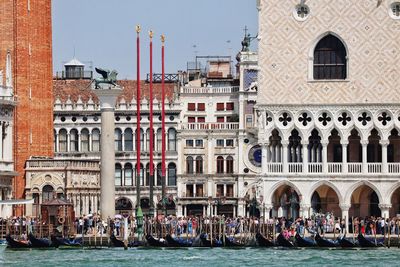 Group of people on boats in canal