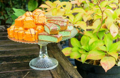 Close-up of dessert on cakestand at table