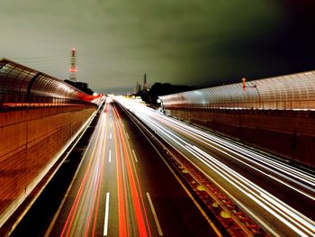 Light trails on highway in city at night