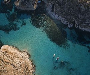 High angle view of people swimming in sea