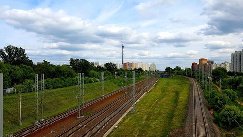 High angle view of railroad tracks in city against sky