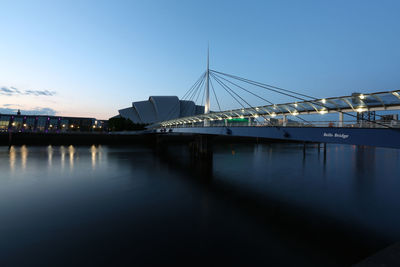 View of bridge over river against blue sky