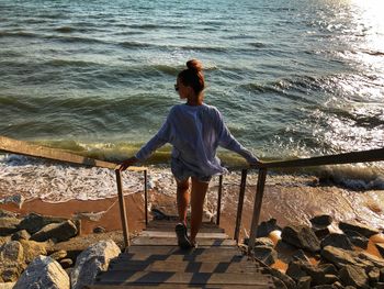 Rear view of woman looking at sea