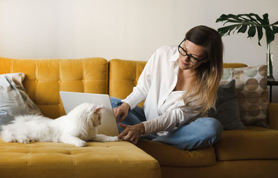 Side view of doctor examining patient at home