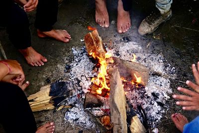 High angle view of people relaxing on barbecue grill