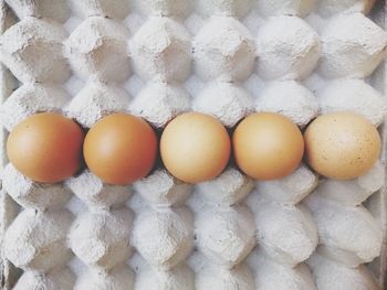 Directly above shot of eggs in container