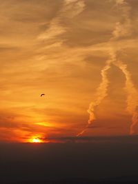 Scenic view of dramatic sky over sea during sunset