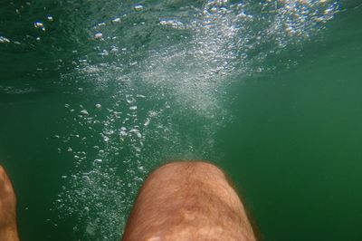 Low section of man in sea