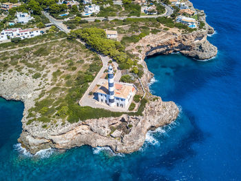 High angle view of old ruins by sea against sky