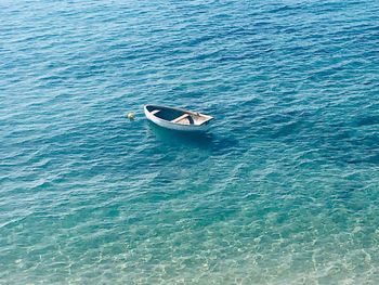 High angle view of boat sailing in sea