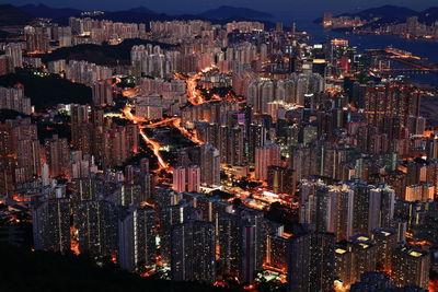 Aerial view of city lit up at night