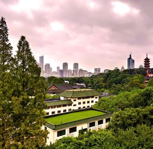 Buildings in city against sky