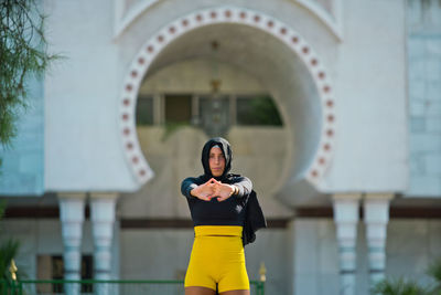 Full length of woman standing outdoors