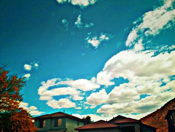 Low angle view of house against blue sky