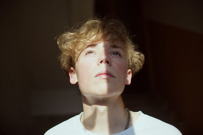 Close-up of thoughtful man looking up