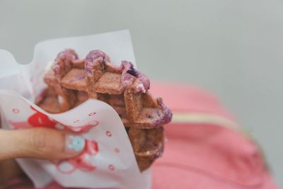 Close-up of hand holding ice cream
