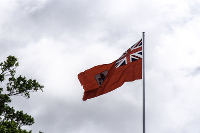 Low angle view of flag against sky