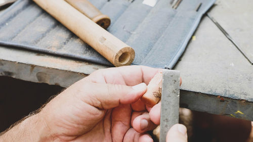 Close-up of hand working in workshop