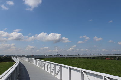Bridge over road against sky