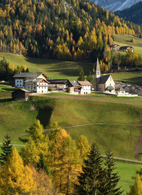 High angle view of trees and buildings against sky