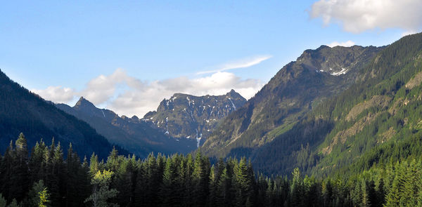 Scenic view of mountains against cloudy sky