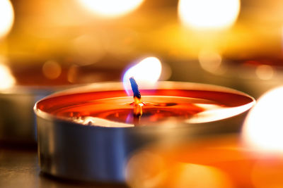 Close-up of lit tea light candles