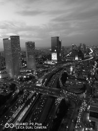 High angle view of city lit up at night