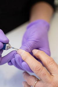 Cropped hand of woman holding hands