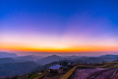 Scenic view of mountains against sky during sunset