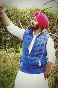 Rear view of a smiling man in a forest